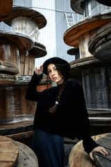 beautiful young woman lady posing outdoors wearing black hat