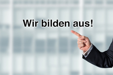 Business man pointing at the words We are looking for employees