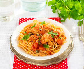 Pasta spaghetti with tuna, capers in tomato sauce