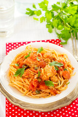 Pasta spaghetti with tuna, capers in tomato sauce