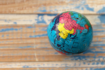 Close up of world globe - top view - travel destination and love different cultures concept - place for text 