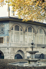Autumn scene of Baghdad Kiosk and fountain at Fourth Courtyard (Imperial Courtyard) of Topkapi Palace, Istanbul, Turkey