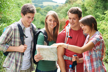 Group Of Young Friends Hiking In Countryside