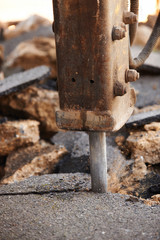 Close Up Of Road Being Dug Up For Repair