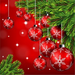 Red christmas ball hanging on pine leaves in red background