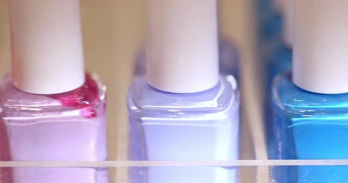 Nail Polish Dolly Left Macro. camera moves left on a row of nail polish very close up.
