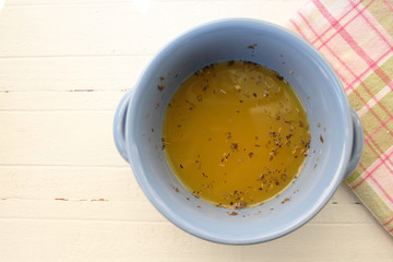 Pumpkin yellow soup in blue dish 