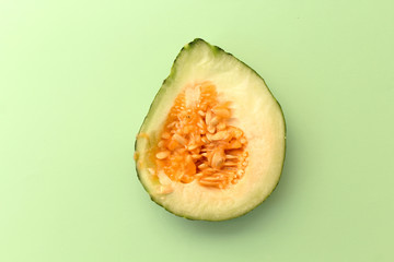 Slice of melon on soft vintage green background