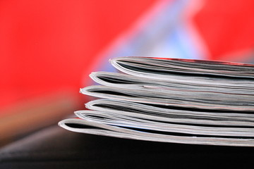 Magazines on the red sofa 