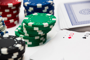 poker chips and card studio shot on a white background
