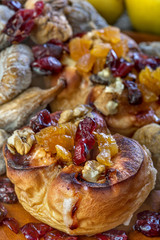 Baked quince with honey, nuts and decorated with diverse dry fruits