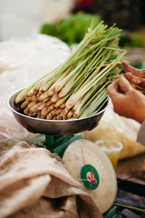 green onionon scales at market for sale
