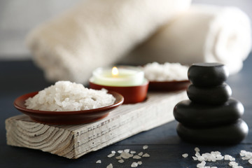 Composition of spa treatment on table colorful background