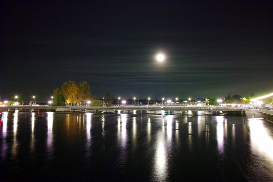 Night photo of Rhone River and Lake of Geneva, Switzerland