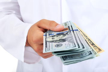 Hand with dollars isolated on white