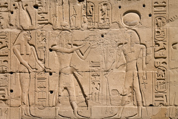 bas-relief on the wall of the ancient temple of Karnak in Luxor