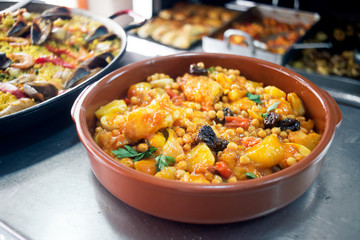 Spanish chickpeas with cod. Rustic Mediterranean style cuisine.