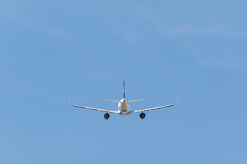 white plane takes off