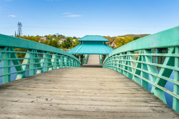 Fototapeta premium Empty Pedestrian Wooden Bridge and Clear Sky