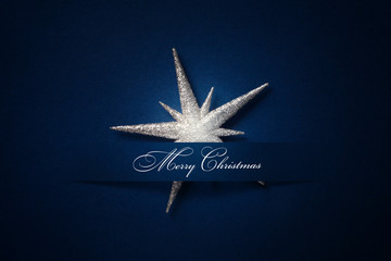 art Christmas background with a silver ornament, christmas stars