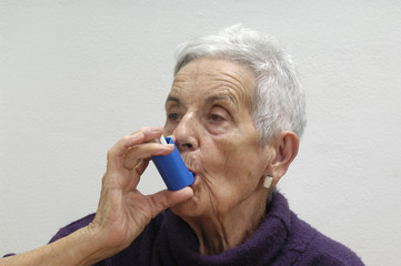 old woman with an inhaler