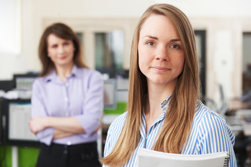 Young Businesswoman With Mentor In Office