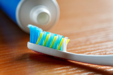 Fototapeta na wymiar toothbrush and toothpaste closeup on table