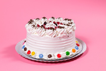 Tasty creamy birthday cake colorful candy adorned