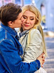 Fototapeta premium Young couple hugging and flirting in park.