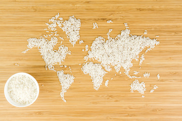 map of the world made of white rice with white ceramic bowl