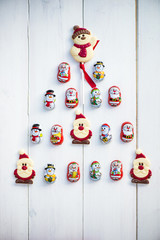 Chocolate Santas, Snowman and Biscuits laying in a form of Chris