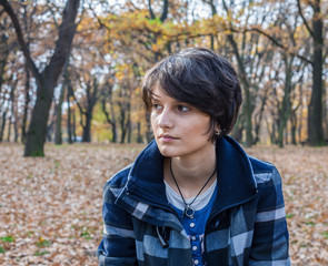 Lonely young woman in a park