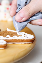 Decorating gingerbread cookies.