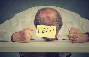 Tired, stressed senior employee needs help