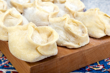 Fototapeta na wymiar Manti or Mantu are dumplings popular in most Asia cuisines