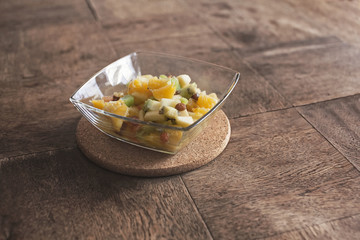 fruit salad in a glass bowl on the table