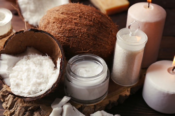 Spa coconut products on dark wooden background