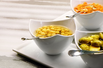 Bowls with garnish on the table in all-inclusive restaurant, close-up