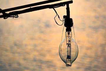 light bulb on boat for caught  fish in sunset time