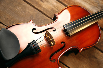 Fototapeta premium Violin on wooden background