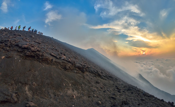 Group of tourists hiking on top of the Stromboli Volcano in the Aeolian Islands, Sicily, Italy