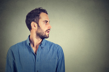 profile of handsome man on gray background