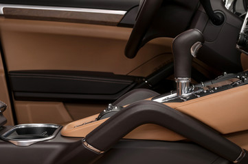 Modern car interior background. Automatic transmission shift lever.