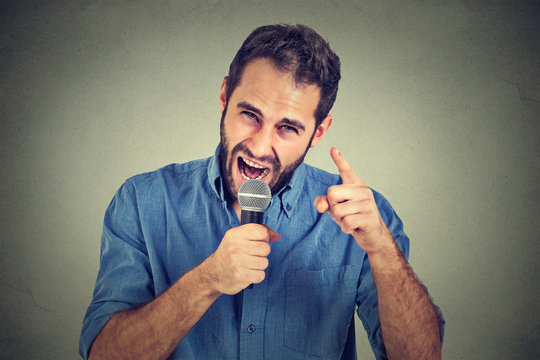 Angry man screaming in microphone