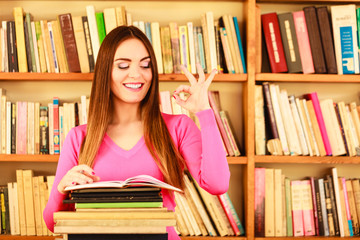 Content girl student in college library