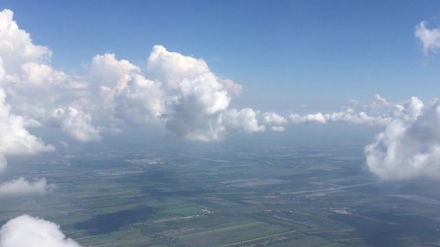 moving clouds seen Through airplane window