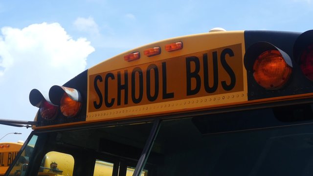 Front of School Bus, Low Angle, Crane Up