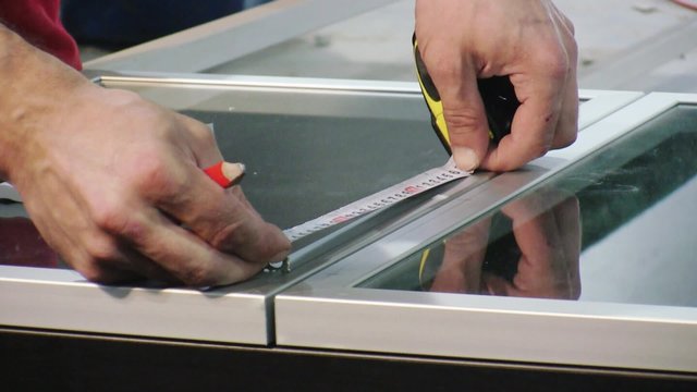 Worker assembling closet in furniture factory.
