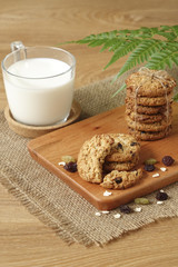 Oat raisin cookies on chopping board