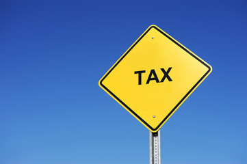 warning sign with tax on it